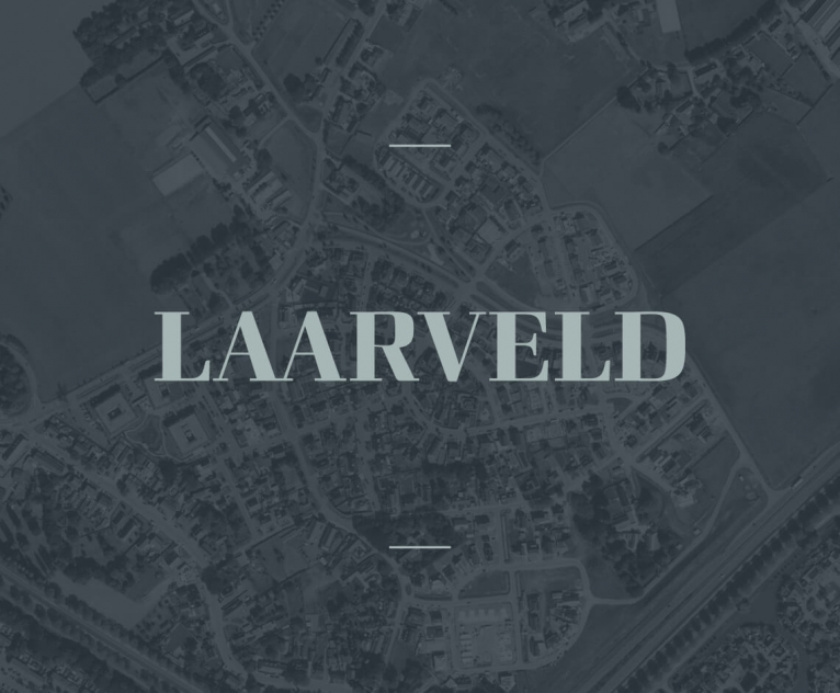 Het logo van Laarveld met een donker Achtergrond foto